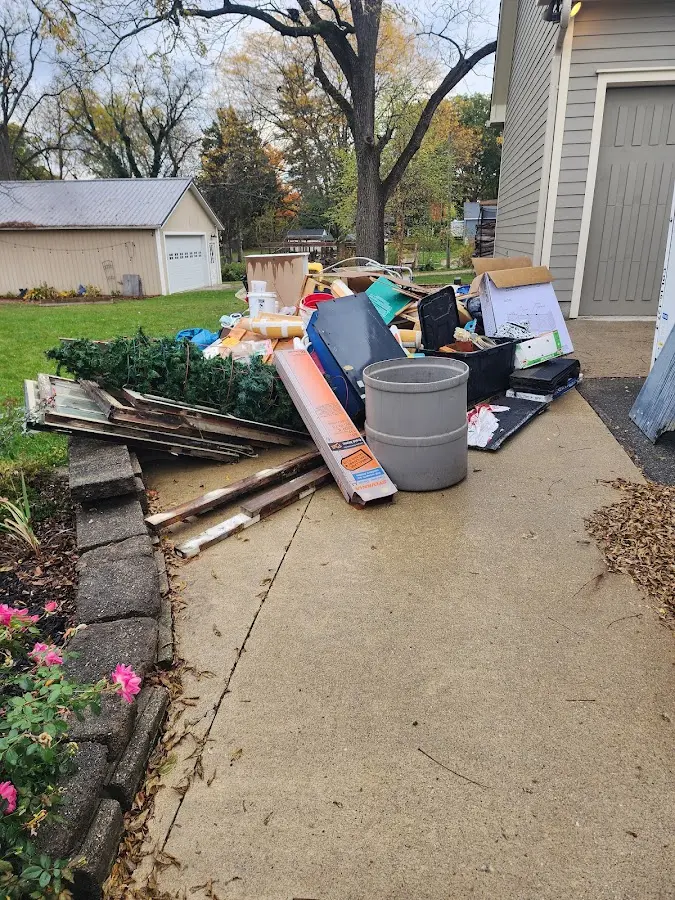 Dumpster being loaded with debris for Estate Cleanout Dumpster Rental in Matteson